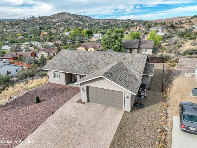 birds eye view of property with a mountain view