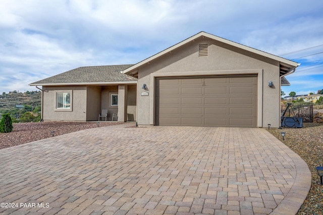 ranch-style home with a garage