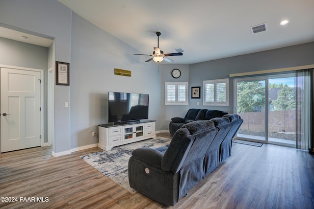 living room with hardwood / wood-style flooring and ceiling fan