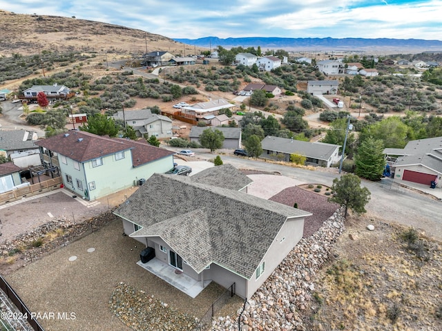 birds eye view of property with a mountain view