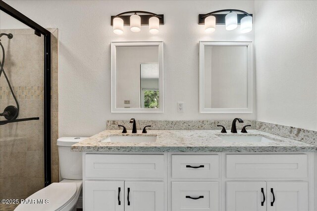 902 Fern Dr, Prescott, AZ 86305 - full bathroom with a stall shower, toilet, and double vanity