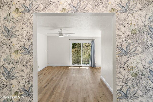 902 Fern Dr, Prescott, AZ 86305 - empty room featuring baseboards, wood finished floors, and a ceiling fan