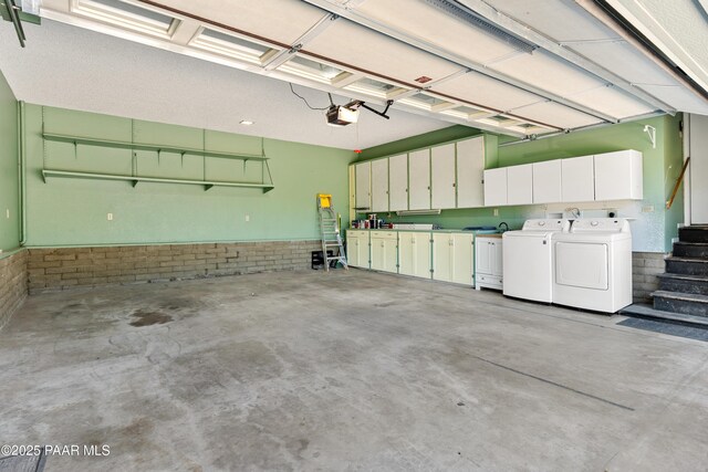 902 Fern Dr, Prescott, AZ 86305 - garage with independent washer and dryer, a garage door opener, and a wainscoted wall