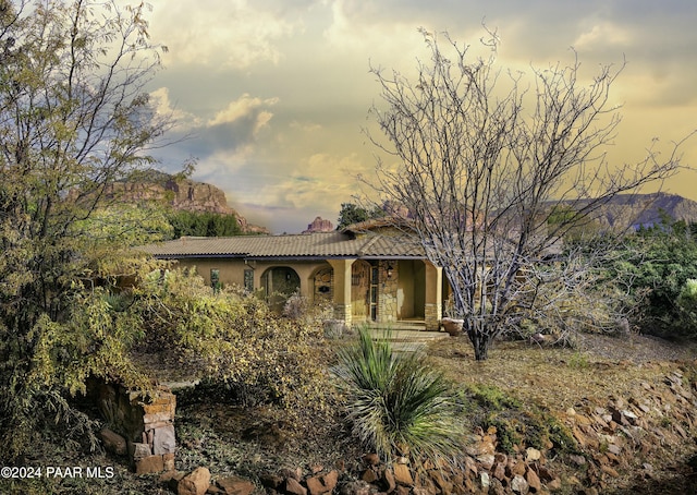 view of front of property with a mountain view