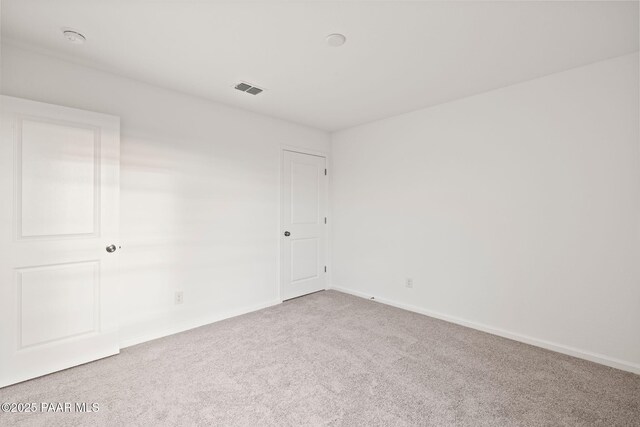 unfurnished room with carpet flooring