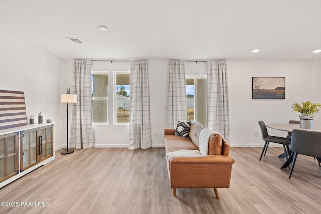 interior space featuring light hardwood / wood-style flooring and a wealth of natural light