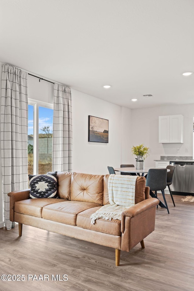 living room with light hardwood / wood-style flooring