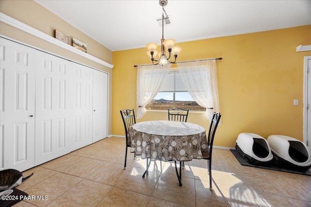 dining room featuring light tile patterned floors and an inviting chandelier