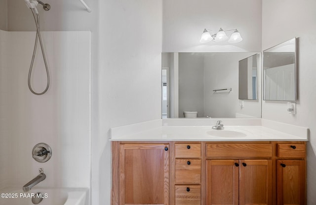 full bathroom featuring bathing tub / shower combination, vanity, and toilet