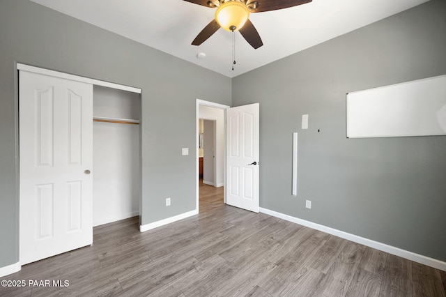 unfurnished bedroom with a closet, ceiling fan, and light hardwood / wood-style flooring