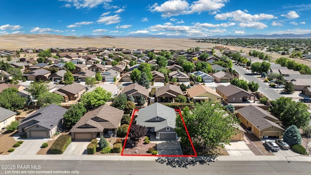 birds eye view of property featuring a mountain view