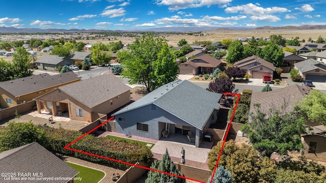 birds eye view of property with a mountain view