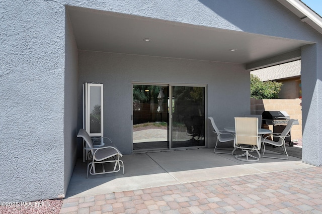 view of patio with a grill