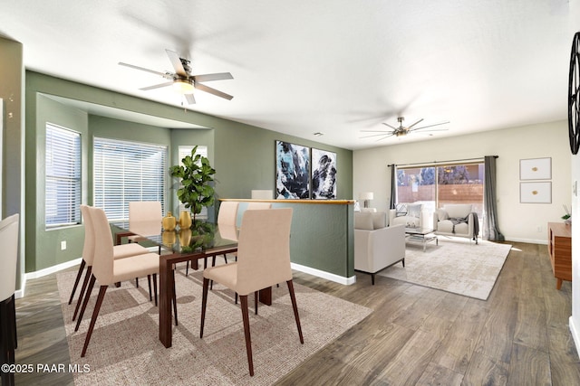 dining area featuring hardwood / wood-style floors and ceiling fan