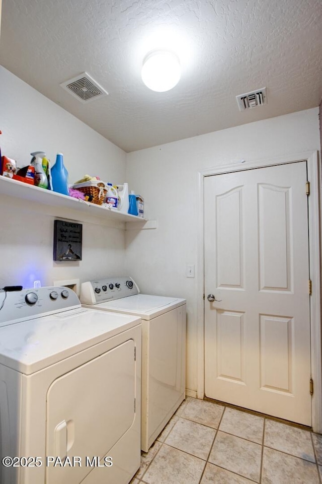 6126 N Little Papoose Dr, Prescott Valley, AZ 86314 - washroom featuring independent washer and dryer, light tile patterned floors, and a textured ceiling