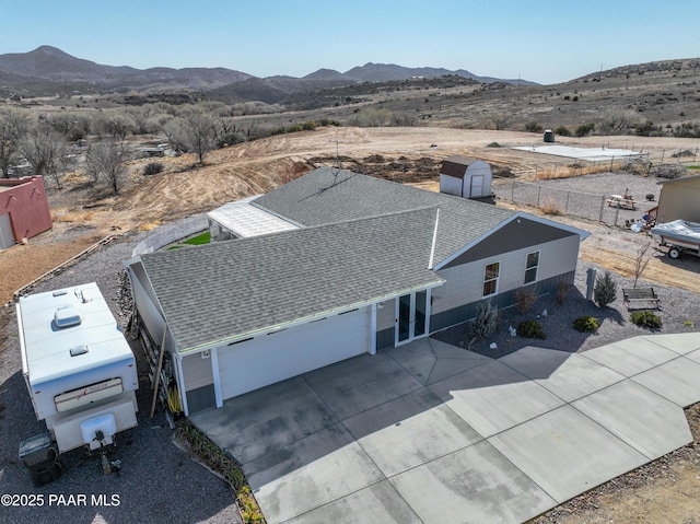 birds eye view of property featuring a mountain view