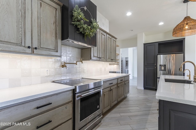 kitchen with open shelves, backsplash, stainless steel appliances, and a sink