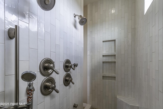 bathroom with a tile shower