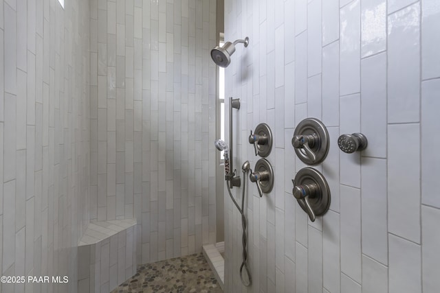 bathroom with a tile shower