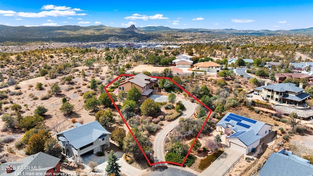 birds eye view of property featuring a mountain view and a residential view
