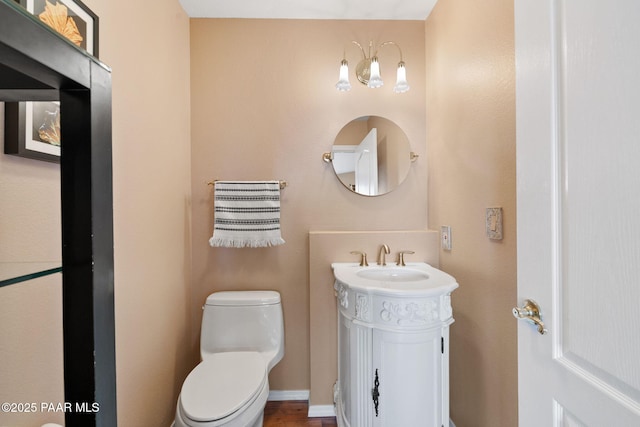 bathroom with toilet and vanity