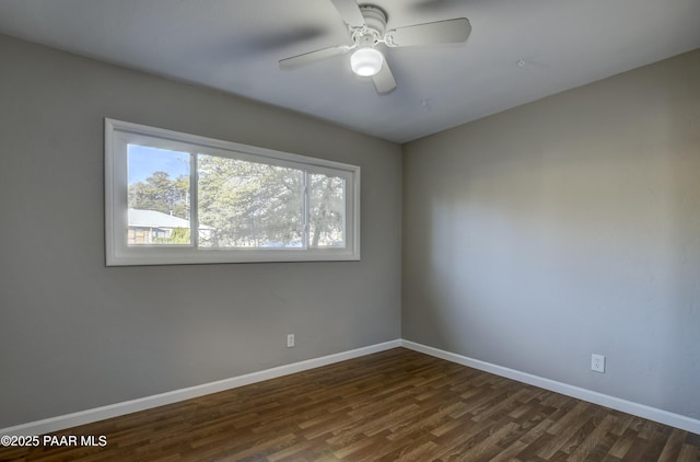 unfurnished room featuring ceiling fan and dark hardwood / wood-style floors