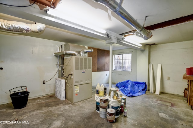 basement featuring heating unit