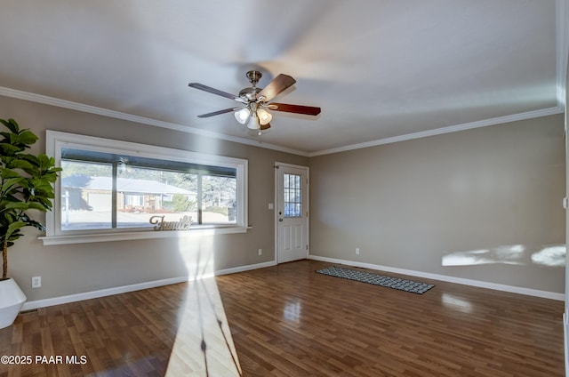 interior space with dark wood-type flooring, ceiling fan, and crown molding