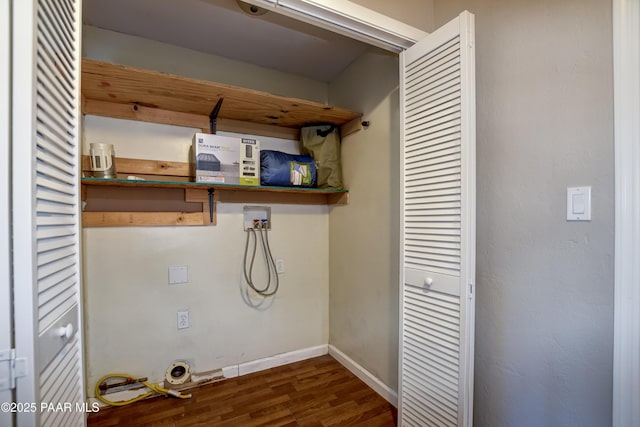 laundry room with electric dryer hookup, washer hookup, and dark hardwood / wood-style flooring