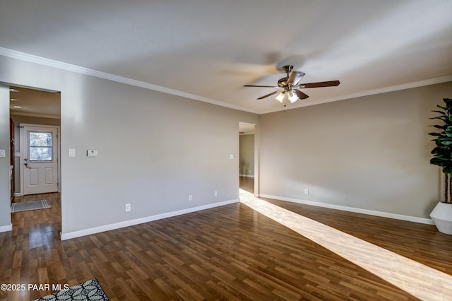 empty room with dark hardwood / wood-style flooring, crown molding, and ceiling fan