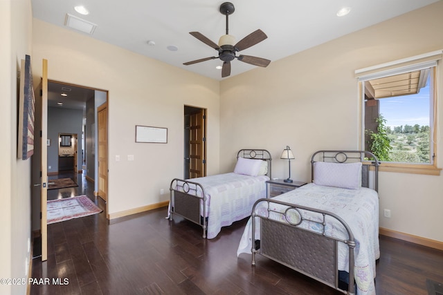 bedroom featuring ceiling fan and dark hardwood / wood-style flooring