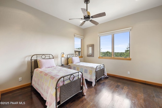 bedroom featuring dark hardwood / wood-style floors and ceiling fan