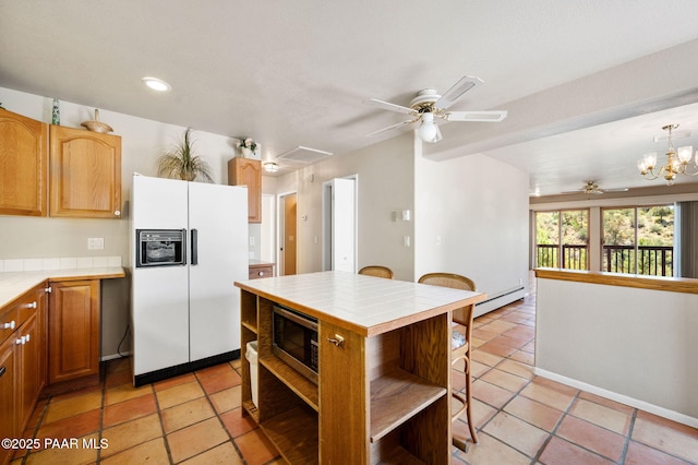 kitchen with open shelves, white refrigerator with ice dispenser, tile countertops, a baseboard heating unit, and ceiling fan with notable chandelier