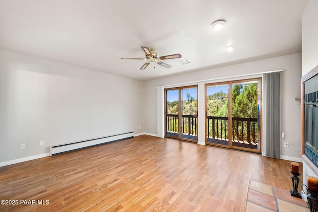 empty room featuring light wood-style floors, baseboards, ceiling fan, and a baseboard heating unit