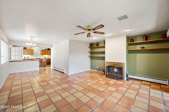 unfurnished living room featuring ceiling fan with notable chandelier, a baseboard heating unit, a warm lit fireplace, and visible vents
