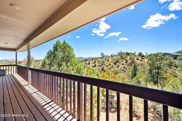 wooden terrace with a mountain view