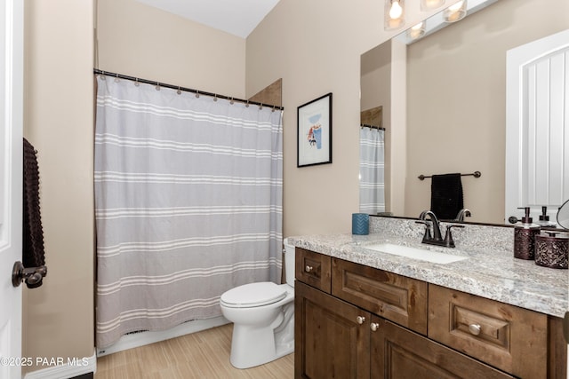 full bath featuring toilet, a shower with curtain, and vanity