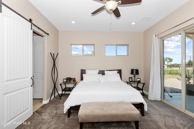 carpeted bedroom featuring access to exterior, visible vents, baseboards, and a barn door