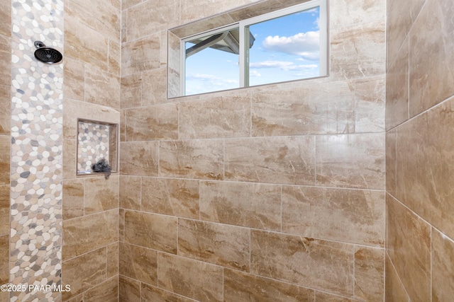 full bath with tiled shower