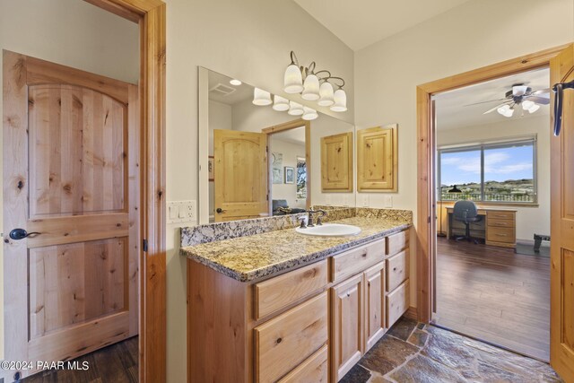 bathroom featuring ceiling fan and vanity