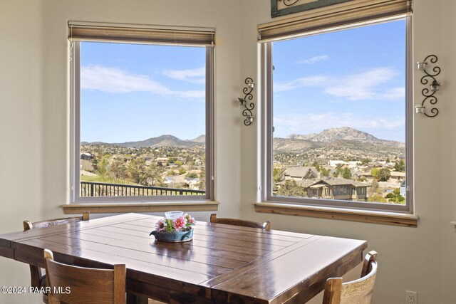 dining area featuring a mountain view and plenty of natural light