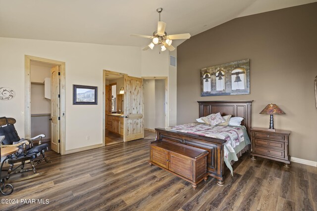 bedroom featuring ensuite bath, vaulted ceiling, and dark hardwood / wood-style floors