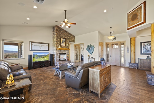 living room featuring ceiling fan, high vaulted ceiling, plenty of natural light, and a fireplace