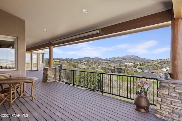 wooden deck with a mountain view