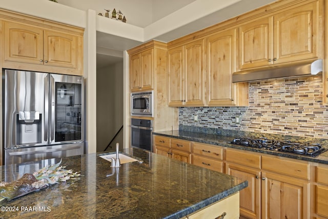 kitchen with tasteful backsplash, dark stone counters, light brown cabinets, and black appliances