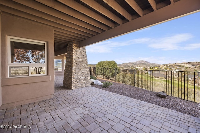 view of patio / terrace with a mountain view