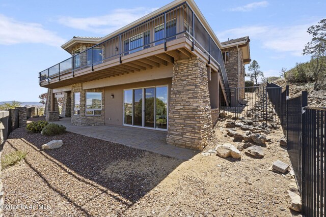 rear view of property with a patio area