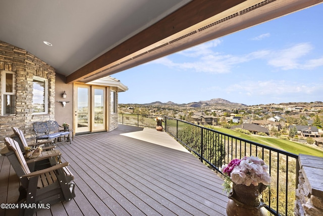 wooden terrace featuring a mountain view