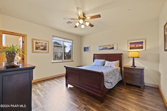 bedroom with dark wood-type flooring and ceiling fan