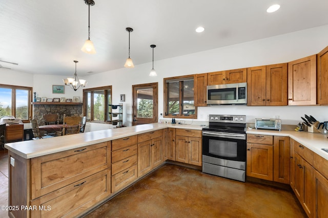 13225 N Bull Run Rd, Prescott, AZ 86305 - kitchen featuring appliances with stainless steel finishes, a peninsula, concrete floors, light countertops, and a chandelier